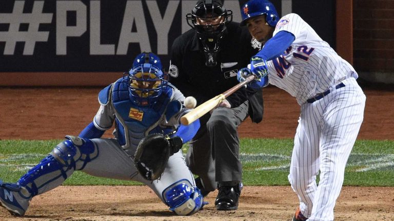 New York Mets outfielder Juan Lagares singles during Game 3 of the World Series against the Kansas City Royals at Citi Field on Friday, Oct. 30, 2015.Kathleen Malone-Van Dyke
