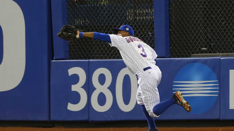 New York Mets rightfielder Curtis Granderson makes the catch on Kansas City Royals second baseman Ben Zobrist in the fifth inning during Game 3 of the World Series against the Kansas City Royals at Citi Field on Friday, Oct. 30, 2015.