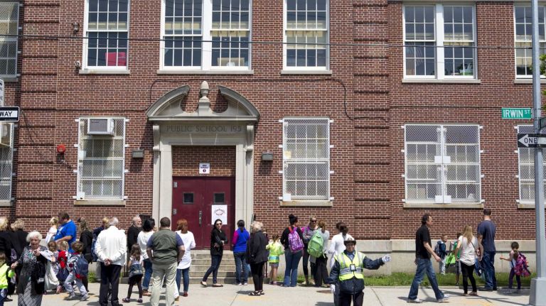 Guardians pick up students after school in front of P.S. 195, Manhattan Beach School, at Manhattan Beach, New York, on June 8, 2015. ?By Yeong-Ung Yang
