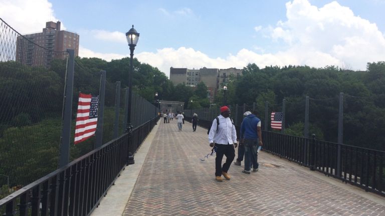 Pedestrians on the newly reopened High Bridge connecting the Bronx to Upper Manhattan on Tuesday, June 9, 2015. 