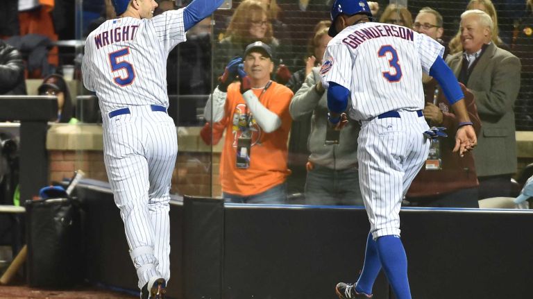 New York Mets third baseman David Wright (5) smacks a homerun in first inning and reacts at home during Game 3 of the World Series against the Kansas City Royals at Citi Field on Friday, Oct. 30, 2015.