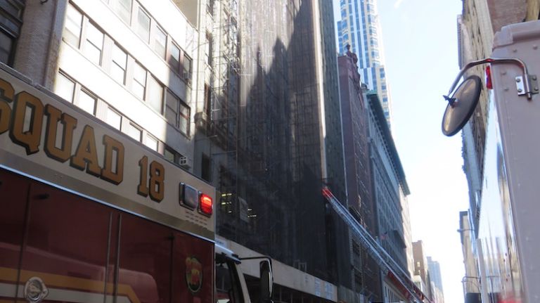 Authorities respond to the scene of a fatal building collapse at 25 W. 38th St.