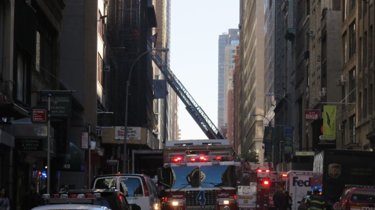 Authorities respond to the scene of a fatal building collapse at 25 W. 38th St.