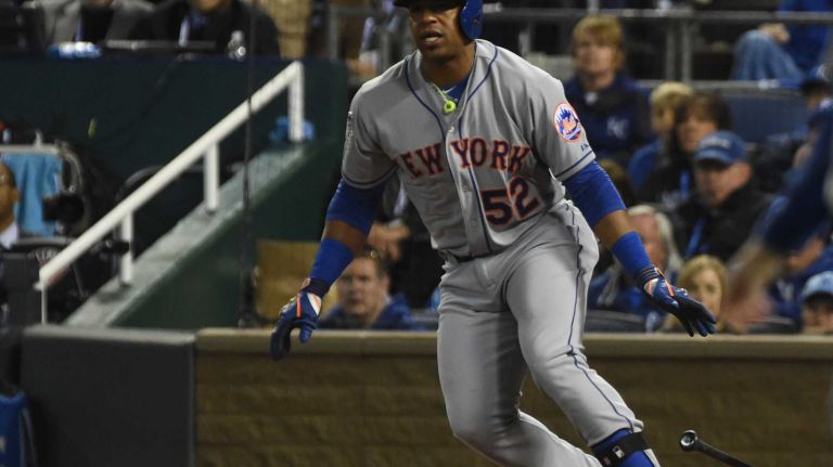 World Series Game 2: Mets vs. Royals 48 New York Mets center fielder Yoenis Cespedes (52) smacks a single in the fourth inning during Game 2 of the World Series against the Kansas City Royals at Kauffman Stadium on Wednesday, Oct. 28, 2015.