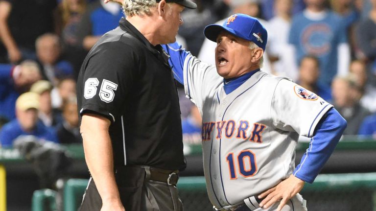 NLCS Game 3: Mets vs. Cubs 44 New York Mets manager Terry Collins (10) argues the call with umpire Ted Barrett (65) after New York Mets shortstop Wilmer Flores (4) hit a ground-rule double into the ivy during Game 3 of the NLCS against the Chicago Cubs at Wrigley Field on Tuesday, Oct. 20, 2015.
