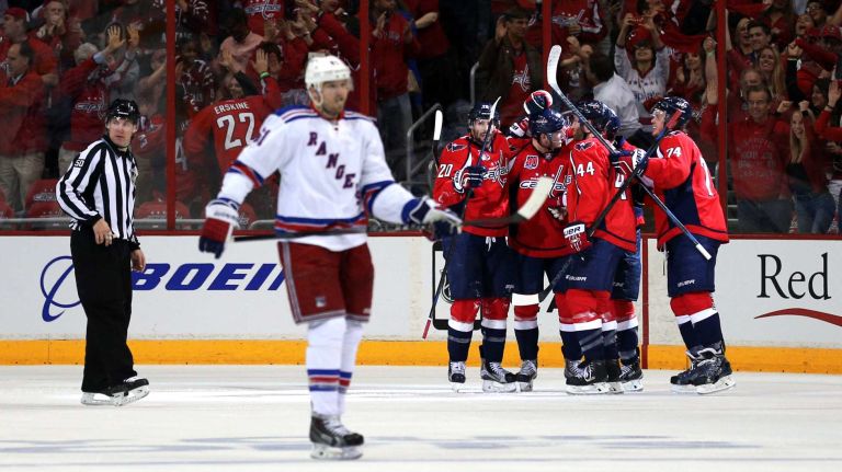 Jay Beagle #83 of the Washington Capitals celebrates with teammates after scoring a goal against the New York Rangers during the second period in Game 3 of the Eastern Conference semifinals during the 2015 NHL Stanley Cup playoffs at Verizon Center on May 4, 2015 in Washington.