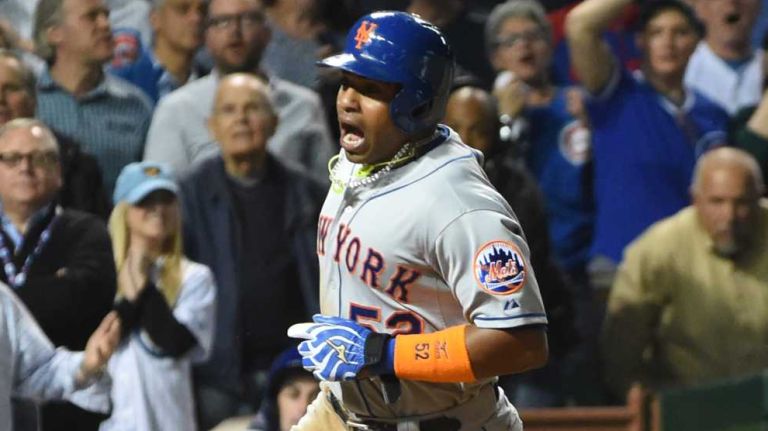 NLCS Game 3: Mets vs. Cubs 47 Chicago Cubs catcher Miguel Montero (47) cannot stop the ball as New York Mets leftfielder Michael Conforto (30) strikes out and New York Mets centerfielder Yoenis Cespedes (52) scores in the sixth inning during Game 3 of the NLCS at Wrigley Field on Tuesday, Oct. 20, 2015.