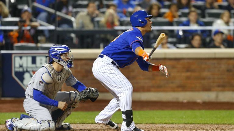 Michael Conforto #30 of the New York Mets follows through on a seventh inning run-scoring sacrifice fly against the Los Angeles Dodgers at Citi Field in Queens during Game 3 of the NLDS on Monday, Oct. 12, 2015