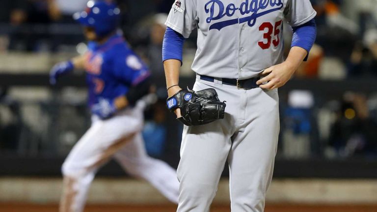 Brett Anderson #35 of the Los Angeles Dodgers looks on after surrendering a third inning two-run home run against Travis d'Arnaud #7 of the New York Mets at Citi Field in Queens during Game 3 of the NLDS on Monday, Oct. 12, 2015.