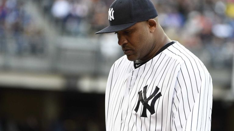 New York Yankees starting pitcher CC Sabathia walks to the dugout after being taken out of the game during the sixth inning against the New York Mets in a baseball game at Yankee Stadium on Saturday, April 25, 2015.