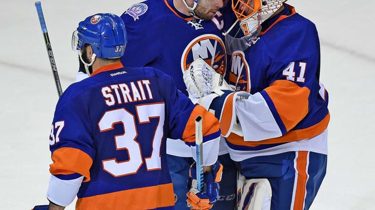 Eastern Conference quarterfinals Game 6: Islanders vs. Capitals 63 New York Islanders' John Tavares and Jaroslav Halak celebrate their victory over the Washington Capitals during Game 6 of the Eastern Conference quarterfinals at Nassau Coliseum on Saturday, April 25, 2015.