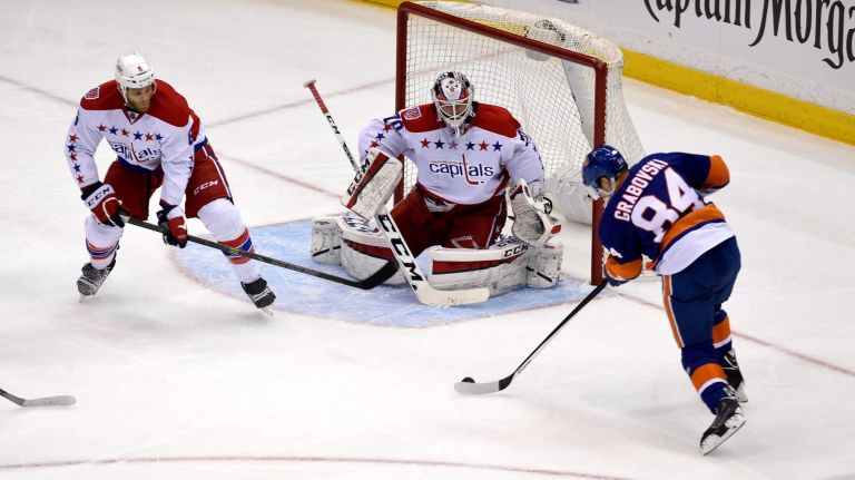 Eastern Conference quarterfinals Game 6: Islanders vs. Capitals 99 New York Islanders' Mikhail Grabovski gets a shot off on Washington Capitals goalie Branden Holtby in the second period during Game 6 of the Eastern Conference quarterfinals at Nassau Coliseum on Saturday, April 25, 2015.