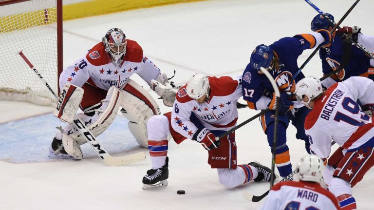 Eastern Conference quarterfinals Game 6: Islanders vs. Capitals 109 New York Islanders' Matt Martin battles for the puck with Washington Capitals' Tim Gleason in front of the Capitals net during the first period in Game 6 of the Eastern Conference quarterfinals at Nassau Coliseum on Saturday, April 25, 2015.