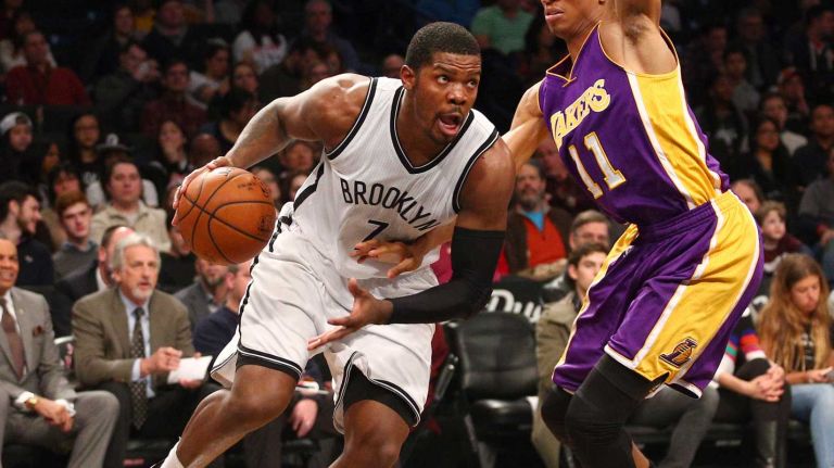 Brooklyn Nets small forward Joe Johnson #7 drives around Los Angeles Lakers small forward Wesley Johnson #11 during the second quarter of a game at Barclays Center on Sunday, March 29, 2015.