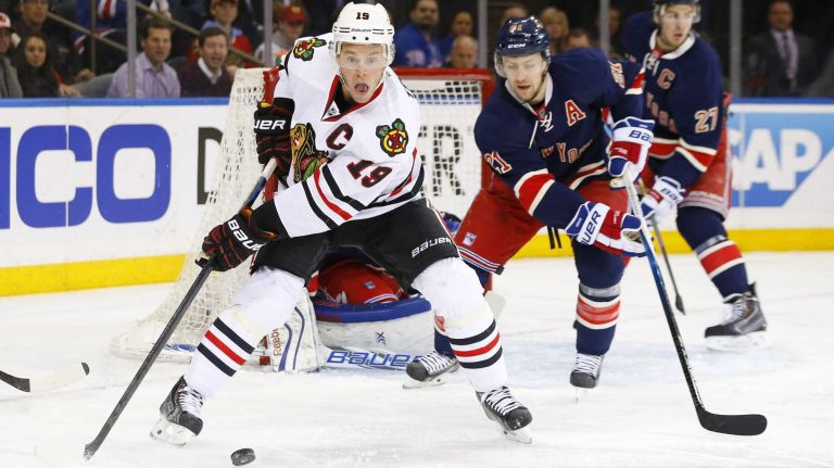 Jonathan Toews of the Chicago Blackhawks controls the puck in the second period against Derek Stepan of the New York Rangers at Madison Square Garden on Wednesday, March 18, 2015.