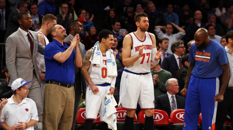 The New York Knicks bench celebrates late in overtime against the San Antonio Spurs at Madison Square Garden on Tuesday, March 17, 2015.