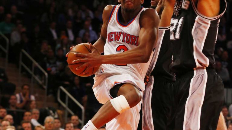 Langston Galloway of the New York Knicks tries to get to the hoop in the second half against Tim Duncan of the San Antonio Spurs at Madison Square Garden on Tuesday, March 17, 2015.