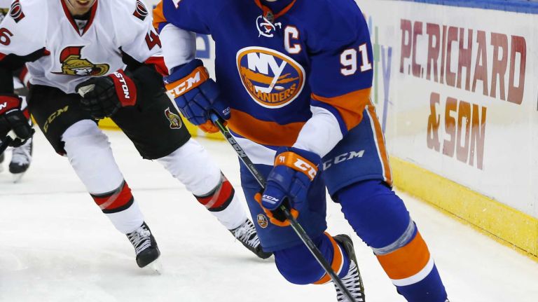 John Tavares of the New York Islanders skates against the Ottawa Senators at Nassau Coliseum on Friday, March 13, 2015.