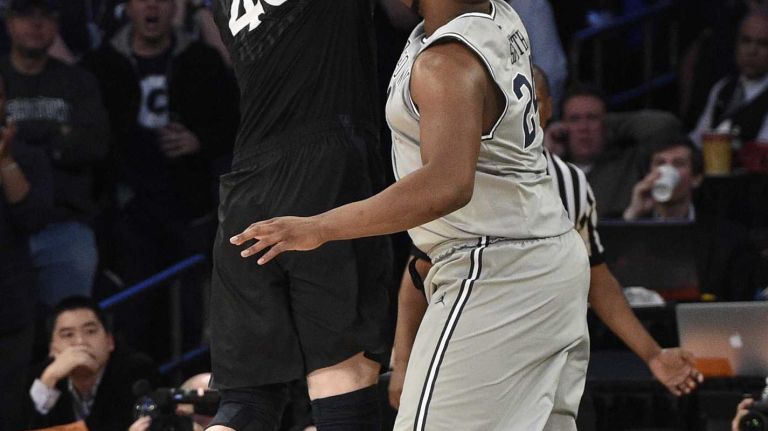 Big East Tournament semifinal: Georgetown vs. Xavier 30 Xavier Musketeers center Matt Stainbrook scores past Georgetown Hoyas center Joshua Smith in a Big East semifinal men's basketball game at Madison Square Garden on Friday, March 13, 2015.