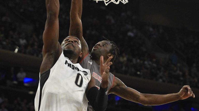 Big East Tournament quarterfinal: St. John's vs. Providence 25 Providence Friars forward Ben Bentil sinks his layup against St. John's Red Storm guard Sir'Dominic Pointer in a Big East quarterfinal men's basketball game at Madison Square Garden on Thursday, March 12, 2015.