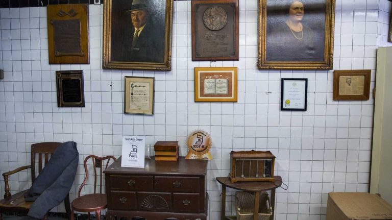 Family paintings, photographs and remembrances are seen at the storefront shop at the Streit's Matzo Factory on Rivington Steet in Manhattan on Monday, March 9, 2015. The factory, a long-established part of the Lower East Side since 1925, is planning to leave the spot by this summer.