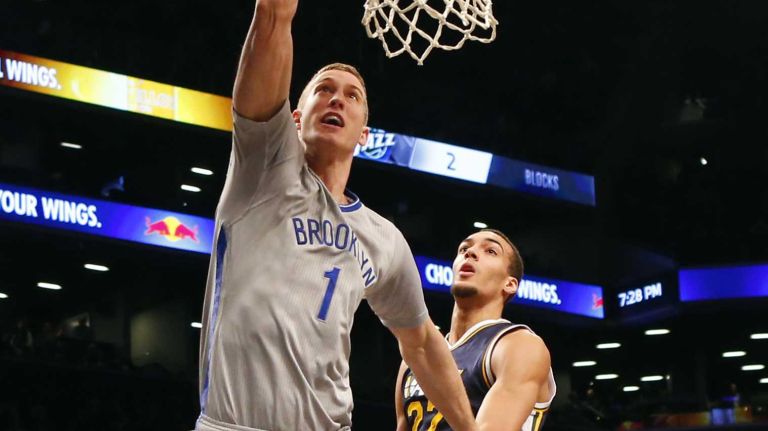 Brooklyn Nets vs. Utah Jazz 68 Mason Plumlee of the Brooklyn Nets dunks the ball in the second half against Rudy Gobert of the Utah Jazz at Barclays Center on Sunday, March 8, 2015 in Brooklyn.
