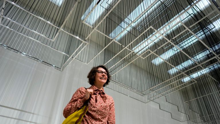 Guggenheim exhibition offers images from Middle East, North Africa 1 Artist Nadia Kaabi-Linke stands under her sculpture