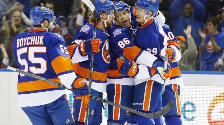 Islanders vs. Flyers 13 Nikolay Kulemin of the New York Islanders celebrates his first-period goal against the Philadelphia Flyers with teammates Johnny Boychuk #55, Calvin de Haan #44 and Brock Nelson #29 at Nassau Coliseum on Monday, Jan. 19, 2015.