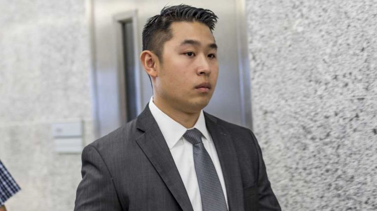 NYPD Officer Peter Liang leaves Supreme Court in Brooklyn after having a trial date set for his manslaughter trial, on Sept. 29, 2015.  