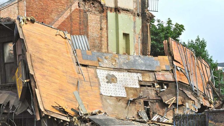 A four-story building at 1438 Fulton St. in the Bed-Stuy section of Brooklyn, collapsed just before 2:30 p.m. on Tuesday, July 14, 2014. The FDNY says three people were treated for non-life-threatening injuries.