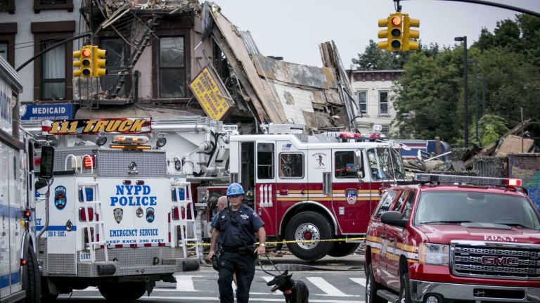 A four-story building at 1438 Fulton St. in the Bed-Stuy section of Brooklyn, collapsed just before 2:30 p.m. on Tuesday, July 14, 2014. The FDNY says at least three passers-by were treated for non-life-threatening injuries after being hit by fallen debris.