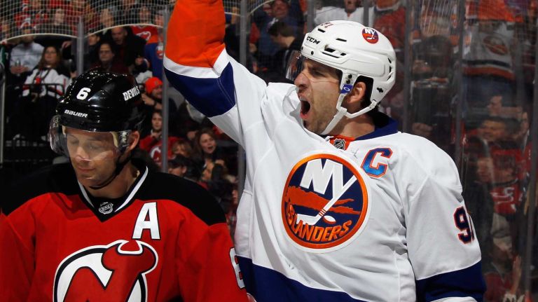 John Tavares of the New York Islanders scores at 13:47 of the third period against the New Jersey Devils to tie the score at the Prudential Center on Jan. 9, 2015 in Newark, N.J.