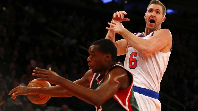 Travis Wear #6 of the New York Knicks loses the ball against Khris Middleton #22 of the Milwaukee Bucks at Madison Square Garden on Sunday, Jan. 4, 2015 in New York City.