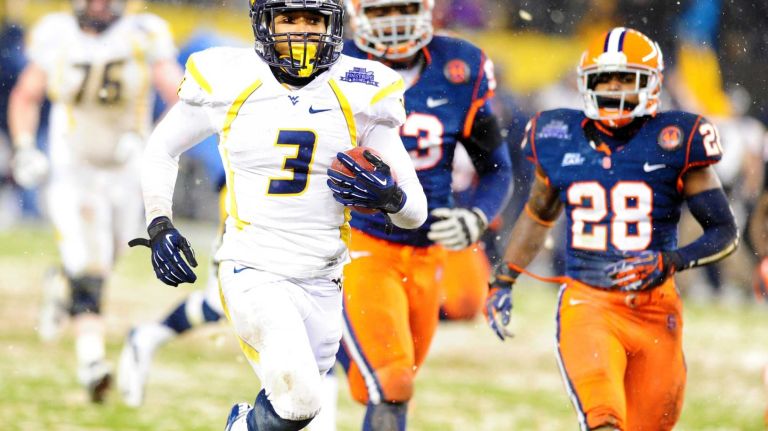 Snow couldn't slow down Syracuse. Prince Tyson-Gulley had 213 rushing yards and two touchdowns and Jerome Smith added 152 rushing yards as the Orange beat West Virginia in the 2012 Pinstripe Bowl, 38-14, in front of 39,098 bundled-up fans. Interestingly, the two starting quarterbacks in this game would go on to be drafted by New York pro football teams more than four months later. Future Giants backup quarterback Ryan Nassib went 11-of-23 for 130 yards, two touchdowns and an interception, while future Jets signal-caller Geno Smith completed 19 of 28 passes for 201 yards and two touchdowns (both of which went to wide receiver Stedman Bailey).