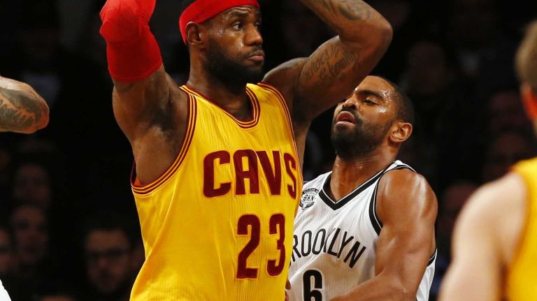 LeBron James #23 of the Cleveland Cavaliers controls the ball against Alan Anderson #6 of the Brooklyn Nets at Barclays Center on Monday, Dec. 8, 2014.