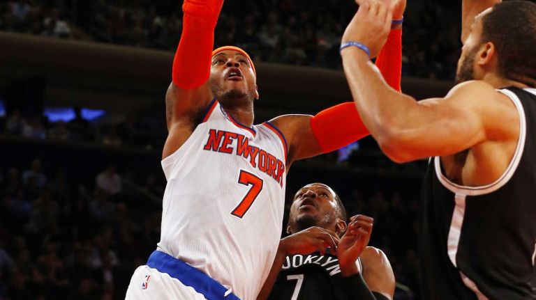 Knicks vs. Nets 30 Carmelo Anthony of the New York Knicks goes to the hoop in the first half against the Brooklyn Nets at Madison Square Garden on Tuesday, Dec. 2, 2014.