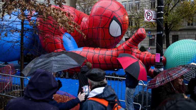 Macy's Thanksgiving Day Parade photos 17 Spider-Man seems to be already flying as people view the Macy's Thanksgiving Day Parade balloons as they are prepared and inflated by the Natural History Museum near the parade route Wednesday, Nov. 26, 2014, in preparation for the decades old tradition of the Thanksgiving Day parade Thursday.