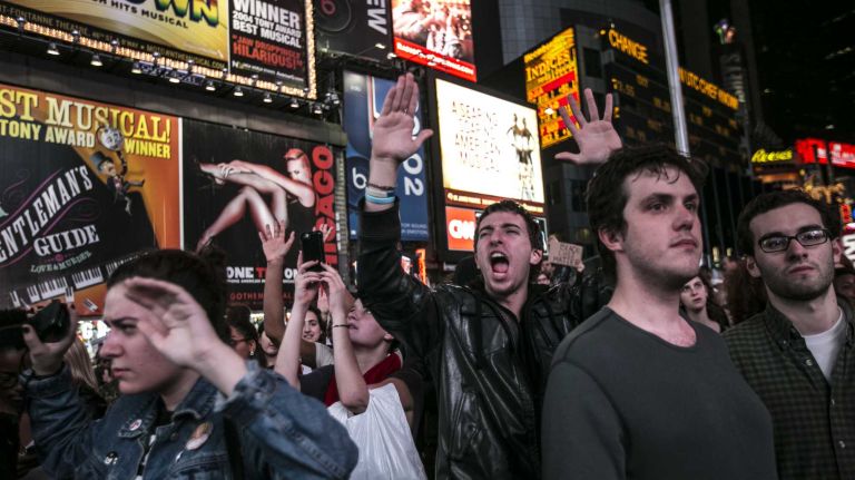 In Times Square, protesters gather following an announcement that a grand jury in Ferguson, Mo., would not indict Ferguson police Officer Darren Wilson for the fatal shooting of Michael Brown. 