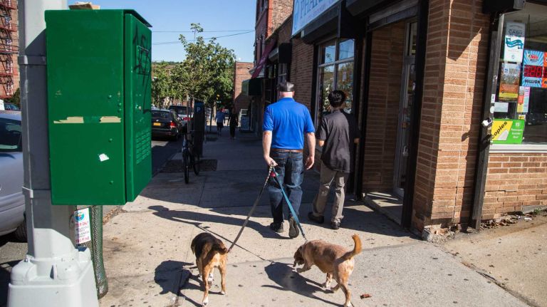 Pedestrians walk in Riverdale.