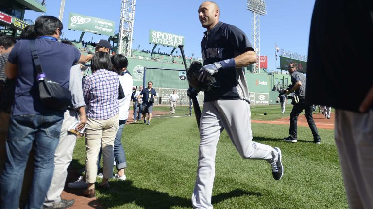 The Yankees' Derek Jeter runs in from batting practice before the start of his last game at Fenway Park on Sunday, Sept. 28, 2014.