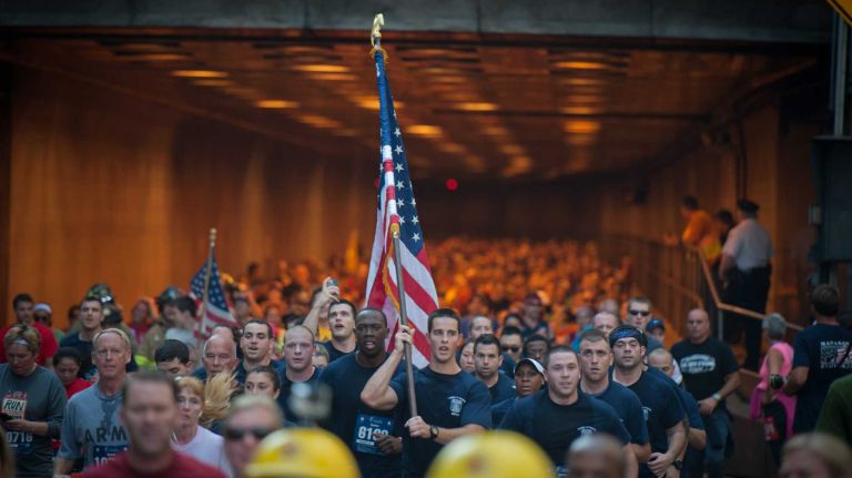 Runners exit the Hugh L. Carey Tunnel on Sunday, Sept. 28, 2014, as part of the 13th Annual Stephen Siller Tunnel to Towers Run that honors fallen 9/11 heroes.