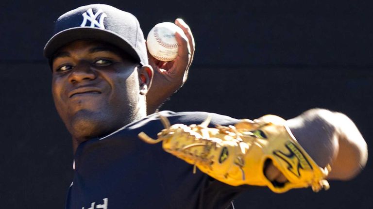 Michael Pineda throws in the bullpen at Steinbrenner Field in Tampa, Fla., on the first day of Yankees spring training on Feb. 14, 2014.