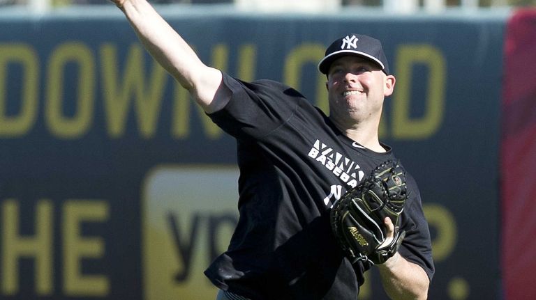 Catcher Brian McCann works out at Steinbrenner Field in in Tampa, Fla., on the first day of Yankees spring training on Feb. 14, 2014.