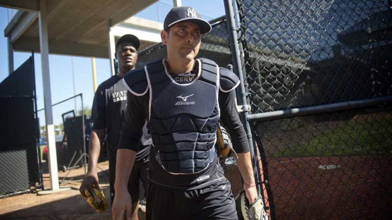 Michael Pineda and catcher Francisco Cervelli work out at Steinbrenner Field in Tampa, Fla., on the first day of Yankees spring training on Feb. 14, 2014.