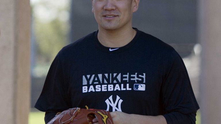 Masahiro Tanaka works out at Steinbrenner Field in Tampa, Fla., on the first day of Yankees spring training on Feb. 14, 2014.