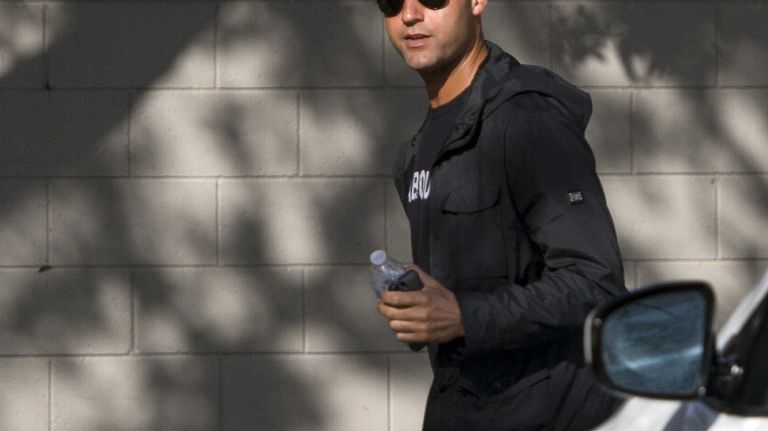 Yankees' Derek Jeter arrives at the team's minor-league facility in Tampa, Fla. on the morning of Feb. 13, 2014, prior to the official start of spring training.