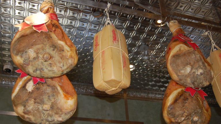 Hanging prosciutto at Di Palo's in Little Italy.