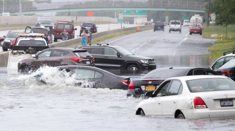 Cars stuck in water from the heavy rain on Sunrise Highway at Carlton Avenue in Islip Terrace on Wednesday, Aug. 13, 2014.