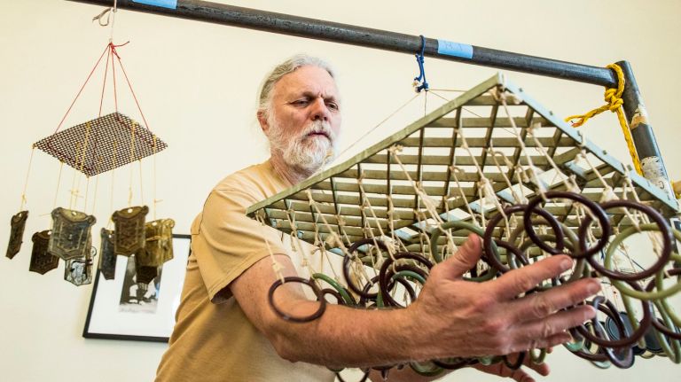 Queens musician recycles trash into soothing rhythms 1 Skip LaPlante of Queens plays music with his wind-chimes made from recycled material and trash at Flushing Town Hall on March 16, 2016.