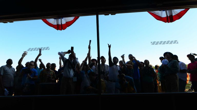 Horse racing enthusiasts try to get autographs from California Chrome's co-owner, Steve Coburn, at Belmont Park in Elmont on Saturday, June 7, 2014. The Belmont Stakes is the third and final leg of the triple crown of horse raising. This year's race marks the 146th running of the stakes where California Chrome will attempt to become racing's 12th Triple Crown winner.
